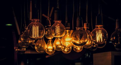 Beautiful glowing golden yellow filament bulbs at night in the interior