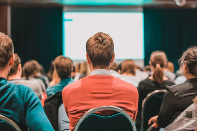 Rear view of people in auditorium