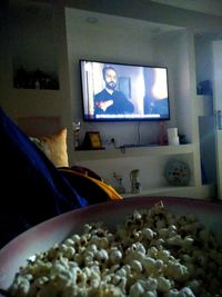 Close-up of illuminated coffee beans on table at home