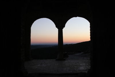 Silhouette of historical building during sunset