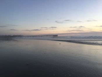 Scenic view of sea against sky at sunset