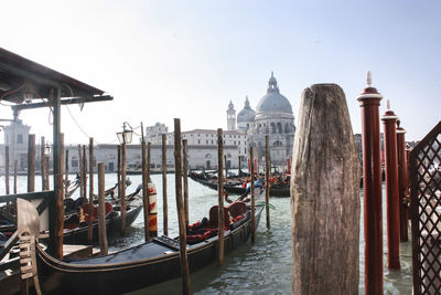 View of boats in canal against sky