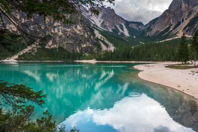 Scenic view of lake and mountains against sky