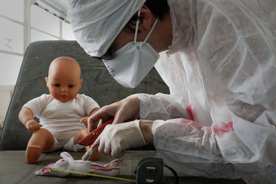 High angle view of cute baby sitting in toy