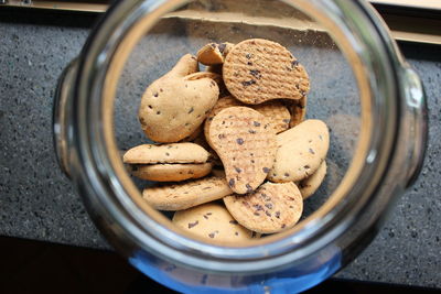 Cookies inside of glass jar on table