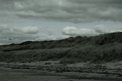 Scenic view of land against sky