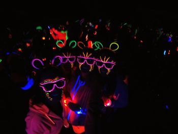 People enjoying music concert at night