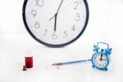 Close-up of clock on table