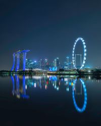 Illuminated buildings in city at night