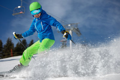 Full length of man skiing on snow