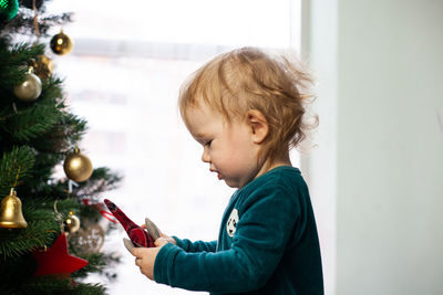 Side view of girl at home