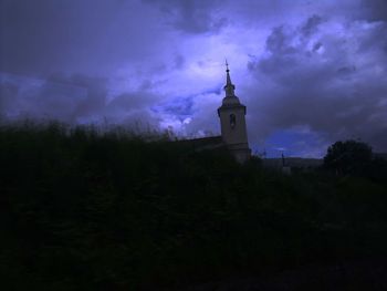 Low angle view of building against sky at night