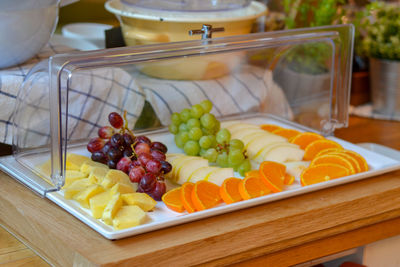 High angle view of fruits in plate on table