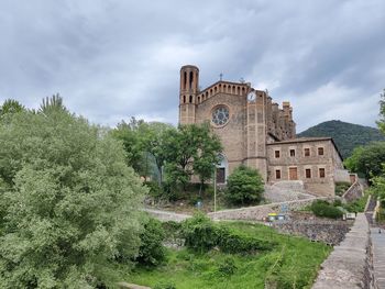 View of historical building against cloudy sky