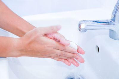 Close-up of woman hand in bathroom