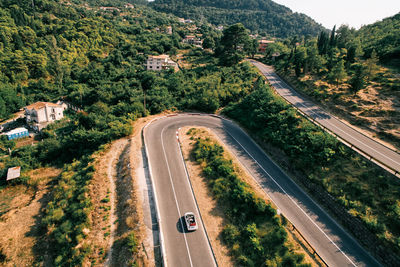 High angle view of road amidst trees