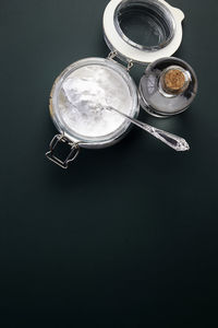 High angle view of food in jar on black background