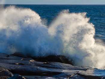 Sea waves splashing on rocks