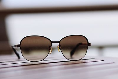 Close-up of sunglasses on table