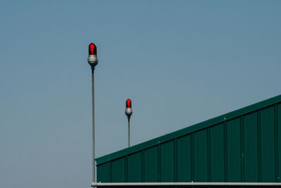 Low angle view of building against clear blue sky