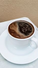 Close-up of coffee cup on table