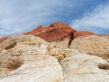 Low angle view of rock formations against sky