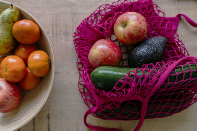 Eco friendly and reusable shopping mesh bag with fruits and vegetables