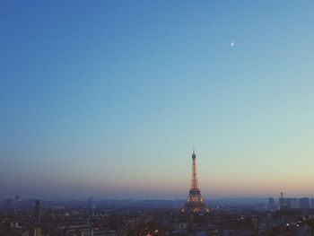 View of cityscape against blue sky