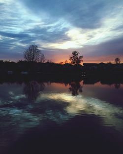 Scenic view of river at sunset