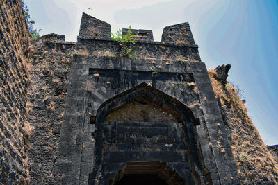 Low angle view of old building against sky