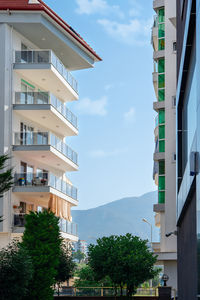 Scenic mountain view between buildings in alanya, turkey. vertical shot.