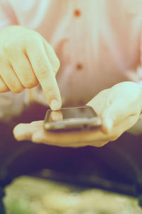 Close-up of hand holding ice cream