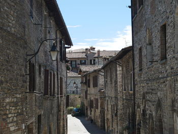 Narrow alley amidst buildings in town