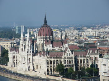 Buildings in city against sky