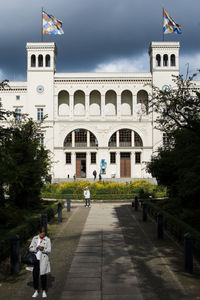 Woman in front of historical building