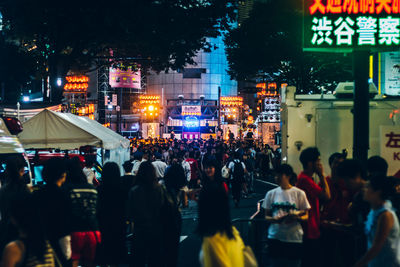 Crowd in city at night