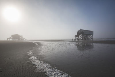 Pier over sea against sky