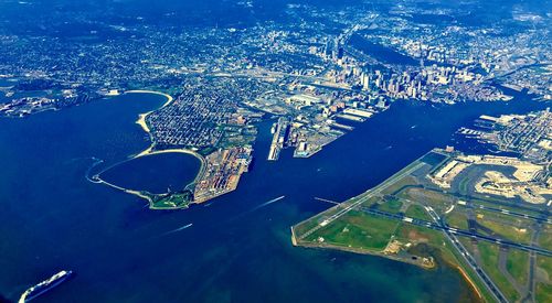 Aerial view of sea and buildings in city