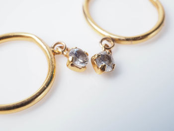 Close-up of wedding rings on table