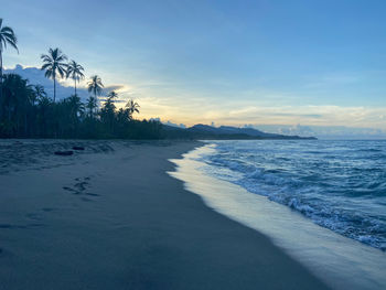 Scenic view of sea against sky at sunset
