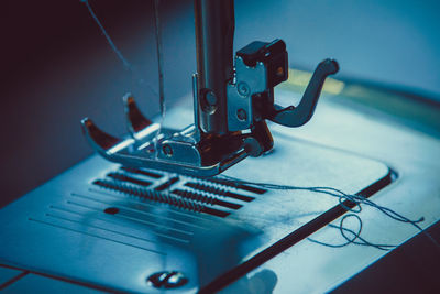 Close-up of machine part on table