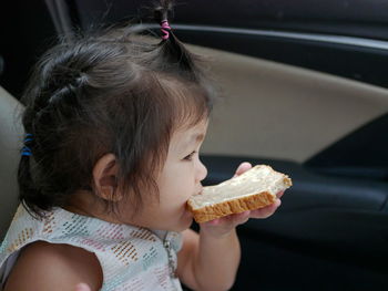 Portrait of girl eating food
