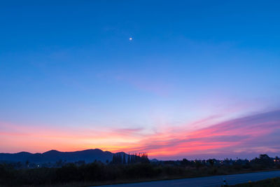 Scenic view of silhouette landscape against romantic sky at sunset