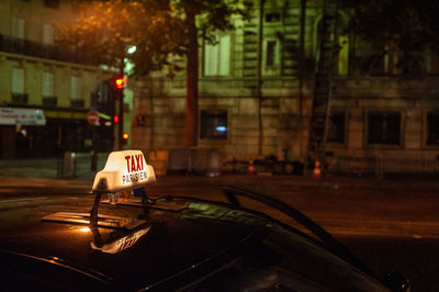 Taxi cab lights at night in paris