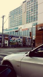 View of street seen through car windshield