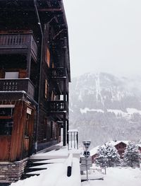 Low angle view of buildings against sky during winter