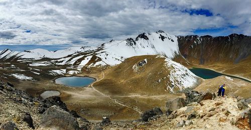 Scenic view of snow covered mountain against sky