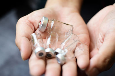 Close-up of person holding glass