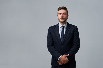 Portrait of young man against white background