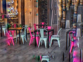 Empty chairs and tables in restaurant